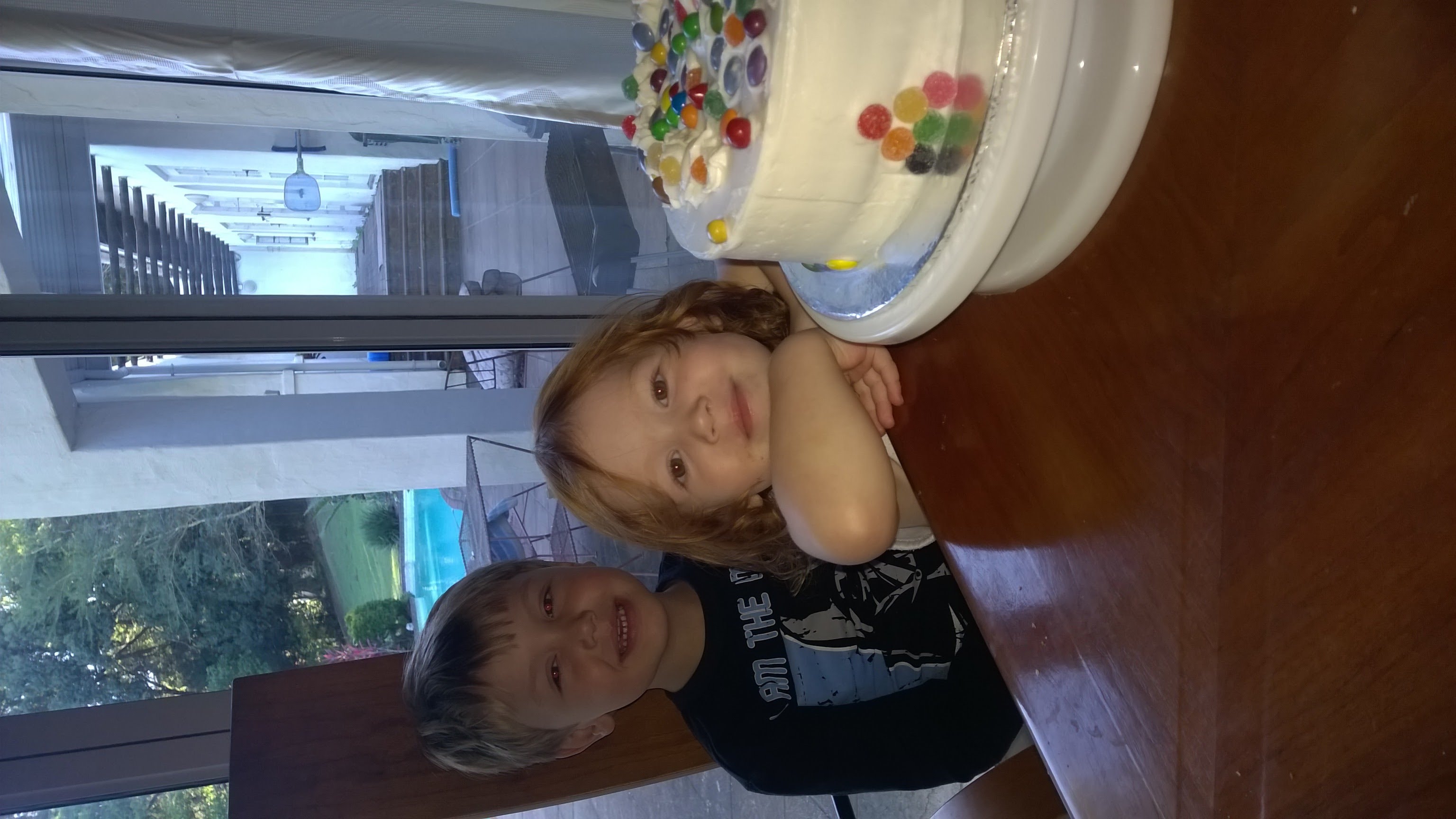 Slicing the colorful cake
